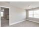Neutral bedroom with natural light coming through windows showing a comfortable and relaxing living space at 120 Gentle Rain Dr, Garner, NC 27529