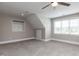 Spacious bonus room featuring plush carpet flooring, vaulted ceilings, and a window at 120 Gentle Rain Dr, Garner, NC 27529