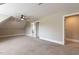 Finished bonus room area featuring carpet flooring and access to other rooms at 120 Gentle Rain Dr, Garner, NC 27529