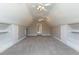 Spacious bonus room features neutral walls, carpet, high ceilings, and ample storage with built-in storage at 120 Gentle Rain Dr, Garner, NC 27529