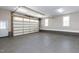Spacious two-car garage with a new garage door and sealed concrete floors at 120 Gentle Rain Dr, Garner, NC 27529