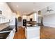 Spacious kitchen with granite counters, black appliances, and breakfast bar at 120 Gentle Rain Dr, Garner, NC 27529