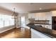 Kitchen featuring granite counters, white cabinets and a view to the breakfast area at 120 Gentle Rain Dr, Garner, NC 27529