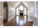 Spacious living room with high ceilings, elegant columns, and fireplace at 120 Gentle Rain Dr, Garner, NC 27529