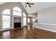 Elegant living room with a fireplace, large windows, and open to the kitchen and dining area at 120 Gentle Rain Dr, Garner, NC 27529