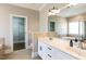 Main bathroom features double sinks, walk-in closet, soaking tub, and a separate shower, designed for comfort and relaxation at 120 Gentle Rain Dr, Garner, NC 27529