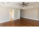 Large main bedroom with beautiful tray ceiling, hardwood floors, and attached bath, offering comfort and style at 120 Gentle Rain Dr, Garner, NC 27529