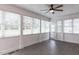 Bright sunroom with tile flooring, a ceiling fan, and plenty of windows for natural light at 120 Gentle Rain Dr, Garner, NC 27529