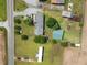 Sprawling country home on a large lot with multiple outbuildings and mature trees, as seen from an aerial perspective at 12294 Nc Hwy 96 S, Dunn, NC 28334