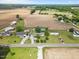 Picturesque aerial view of a home surrounded by fields, providing a sense of peaceful rural living at 12294 Nc Hwy 96 S, Dunn, NC 28334