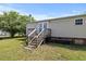 A backyard featuring a back door and stairs, perfect for enjoying outdoor living at 12294 Nc Hwy 96 S, Dunn, NC 28334