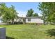 Scenic backyard with lush green grass and a well-groomed landscape, perfect for relaxing and outdoor activities at 12294 Nc Hwy 96 S, Dunn, NC 28334