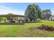 Expansive backyard featuring a spacious barn and playground, perfect for outdoor activities at 12294 Nc Hwy 96 S, Dunn, NC 28334