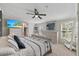 Cozy bedroom with a ceiling fan, dresser, closet and television at 12294 Nc Hwy 96 S, Dunn, NC 28334