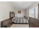 Bedroom with carpet, dark wood furniture, natural light, and neutral walls at 12294 Nc Hwy 96 S, Dunn, NC 28334