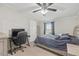 Bedroom with a computer desk, large bed, and a ceiling fan at 12294 Nc Hwy 96 S, Dunn, NC 28334