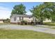 Charming single-story home with a welcoming front porch and well-maintained landscaping at 12294 Nc Hwy 96 S, Dunn, NC 28334