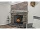 A stone fireplace with a stone hearth, and a decorative mantle at 12294 Nc Hwy 96 S, Dunn, NC 28334