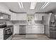Bright kitchen with white cabinets, stainless steel appliances, and modern countertops at 12294 Nc Hwy 96 S, Dunn, NC 28334