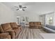 Open-concept living area with comfortable seating, stylish floors, and serene decor at 12294 Nc Hwy 96 S, Dunn, NC 28334