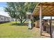 Fun playground with slide, nestled beside a shaded barn, perfect for Gathering enjoyment at 12294 Nc Hwy 96 S, Dunn, NC 28334