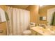 Bathroom with tub/shower, vanity and decorative mirror at 133 Parkhaven Ln, Garner, NC 27529