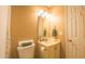 Bathroom with vanity, decorative mirror and overhead lights at 133 Parkhaven Ln, Garner, NC 27529