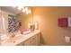 Bathroom featuring double vanity, neutral color palette, and tiled floors at 133 Parkhaven Ln, Garner, NC 27529