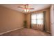 Bedroom with ceiling fan, neutral carpet and window with curtains at 133 Parkhaven Ln, Garner, NC 27529