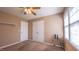 Bedroom with ceiling fan, neutral carpet and double doors at 133 Parkhaven Ln, Garner, NC 27529