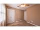 Bedroom with neutral carpet, ceiling fan and double closets at 133 Parkhaven Ln, Garner, NC 27529