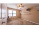 Bedroom with ceiling fan, window and wall-mounted shelving at 133 Parkhaven Ln, Garner, NC 27529