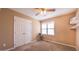 Bedroom with closet, ceiling fan and neutral carpet at 133 Parkhaven Ln, Garner, NC 27529