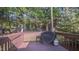 Deck with grill and view of trees at 133 Parkhaven Ln, Garner, NC 27529