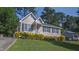 Quaint single Gathering home with manicured lawn, tidy landscaping and easy driveway access at 133 Parkhaven Ln, Garner, NC 27529
