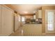 Functional kitchen with an abundance of cabinet space and rear door access at 133 Parkhaven Ln, Garner, NC 27529