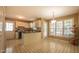 Eat-in kitchen with ample cabinet space, neutral color palette and abundant natural light at 133 Parkhaven Ln, Garner, NC 27529