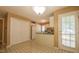 Traditional kitchen features white cabinets, flooring, and pantry space at 133 Parkhaven Ln, Garner, NC 27529