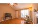 Cozy living room featuring hardwood floors, a fireplace, ceiling fan and an abundance of natural light at 133 Parkhaven Ln, Garner, NC 27529