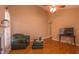 Vaulted living room featuring hardwood floors, fireplace, ceiling fan and neutral color palette at 133 Parkhaven Ln, Garner, NC 27529