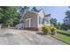 This home features convenient parking and an attractive, well-maintained side yard with verdant landscaping at 133 Parkhaven Ln, Garner, NC 27529