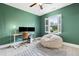 Bright bedroom with a cozy beanbag chair and a modern desk setup, creating an inviting space for relaxation or work at 1602 Bowery Dr, Raleigh, NC 27607