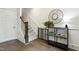 Inviting entryway showcasing hardwood floors, elegant decor, and staircase at 1602 Bowery Dr, Raleigh, NC 27607