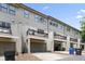 Rear exterior elevation featuring garages and decks at 1602 Bowery Dr, Raleigh, NC 27607