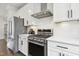 Well-equipped kitchen with stainless steel appliances, ample counter space, and tile backsplash at 1602 Bowery Dr, Raleigh, NC 27607