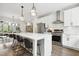 Modern kitchen with a center island, stainless steel appliances, and open layout at 1602 Bowery Dr, Raleigh, NC 27607