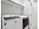 Convenient laundry room with modern, white, front-loading washer and dryer at 1602 Bowery Dr, Raleigh, NC 27607