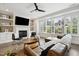 Cozy living room with fireplace, built-in shelving, and a comfortable leather sofa at 1602 Bowery Dr, Raleigh, NC 27607