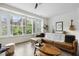 Stylish living room with large windows, hardwood floors, and comfortable seating at 1602 Bowery Dr, Raleigh, NC 27607