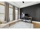 Stylish office with a modern desk setup, ample light, and dark accent wall at 1602 Bowery Dr, Raleigh, NC 27607